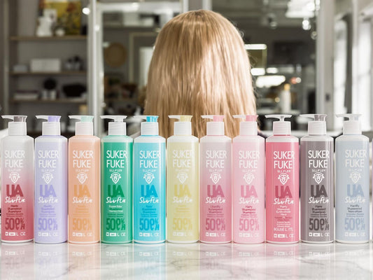 Colorful sulfate-free shampoo bottles on salon countertop