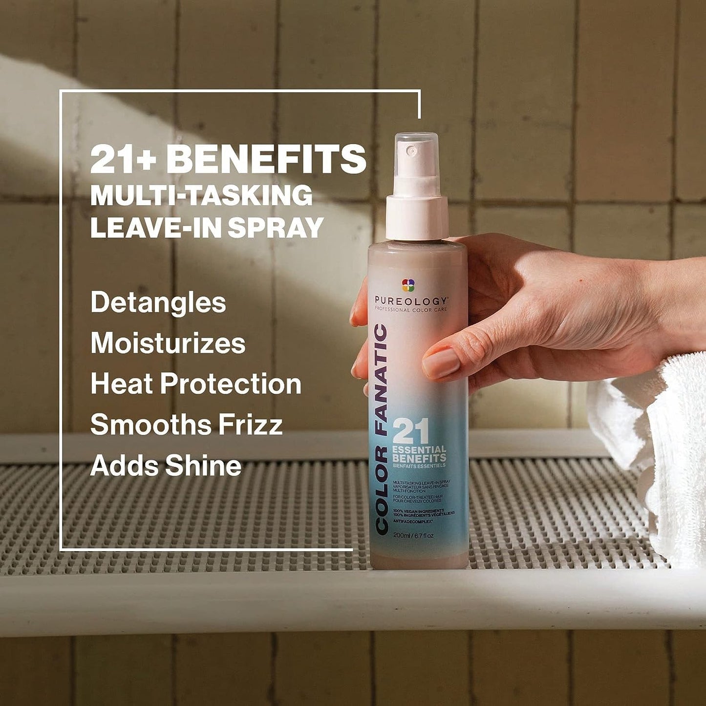 Pureology Colour Fanatic Leave-in Treatment Spray showcasing 21 benefits for color-treated hair in a stylish setting.