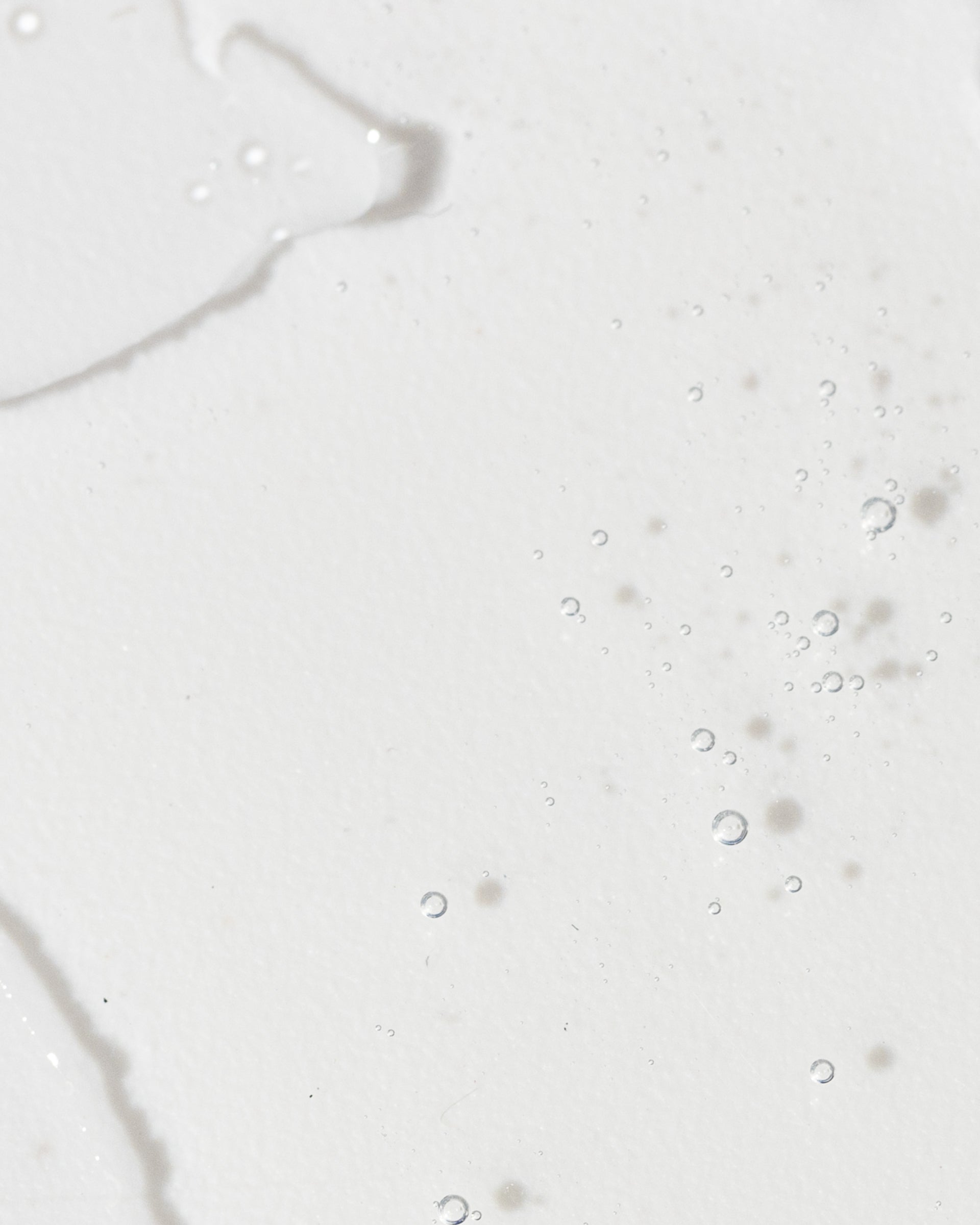 Close-up of a light serum with bubbles, illustrating the texture and clarity of Advanced Skin Lightening Serum.