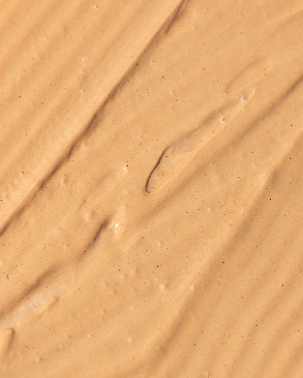 Creamy texture of Vivier Ultra Purifying Clay Mask, featuring red and white Kaolin clay for skincare benefits.