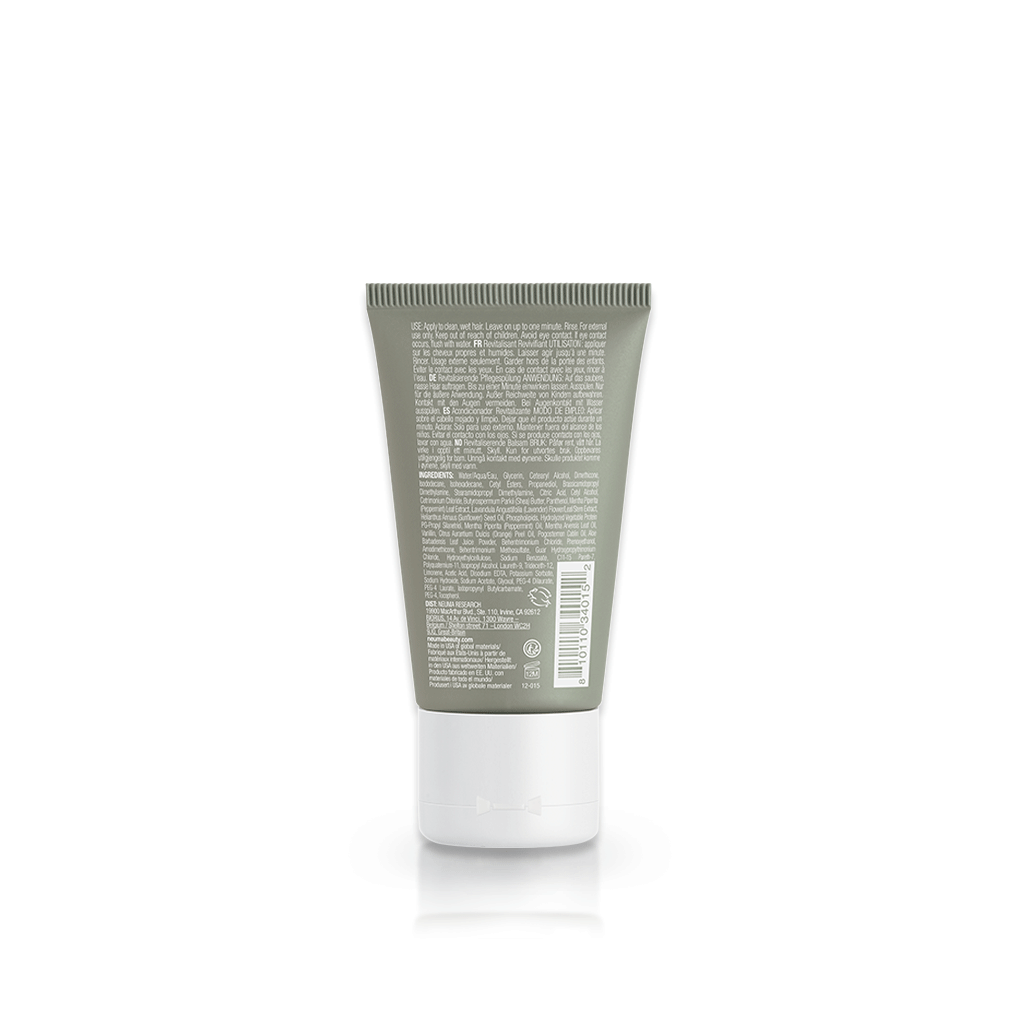 Re Neu Conditioner tube back view displaying ingredients and benefits for soft, shiny hair with peppermint and vanilla aroma.