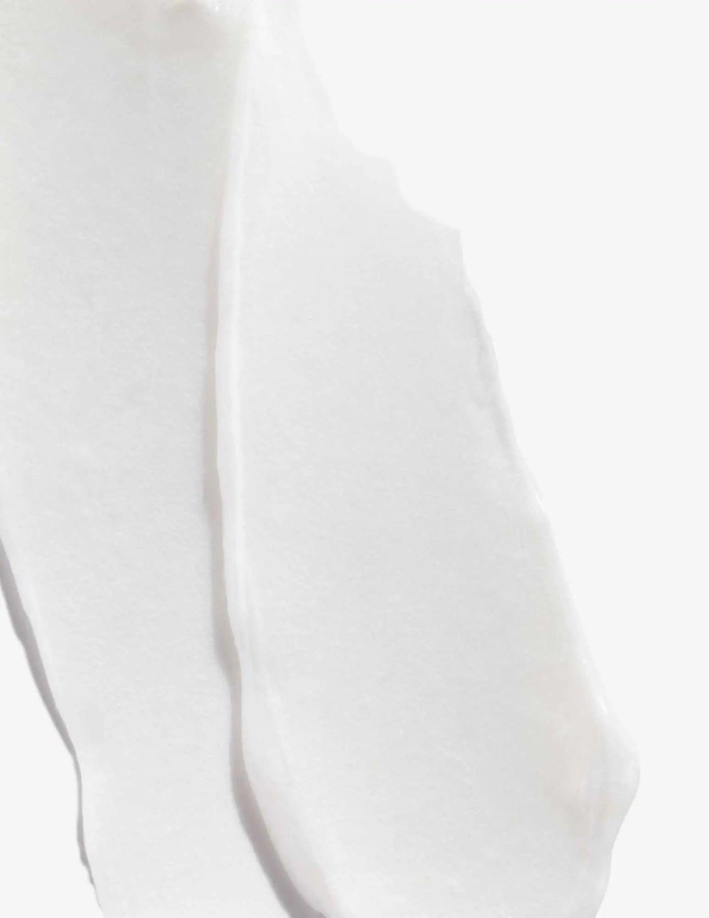 Smooth, creamy texture of Acidic Bonding Concentrate Conditioner on a white background.