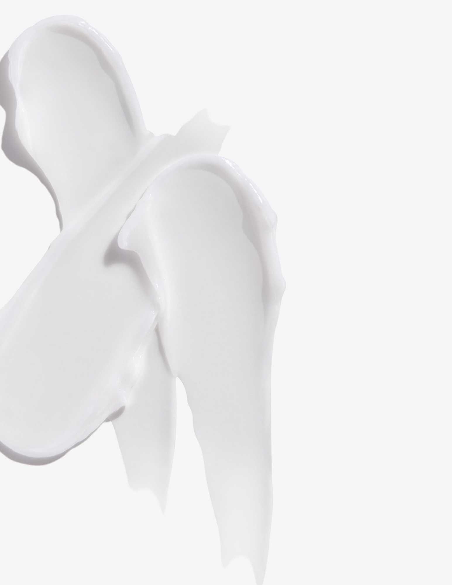 Creamy texture of Redken All Soft Heavy Cream for intense hair conditioning and moisture.