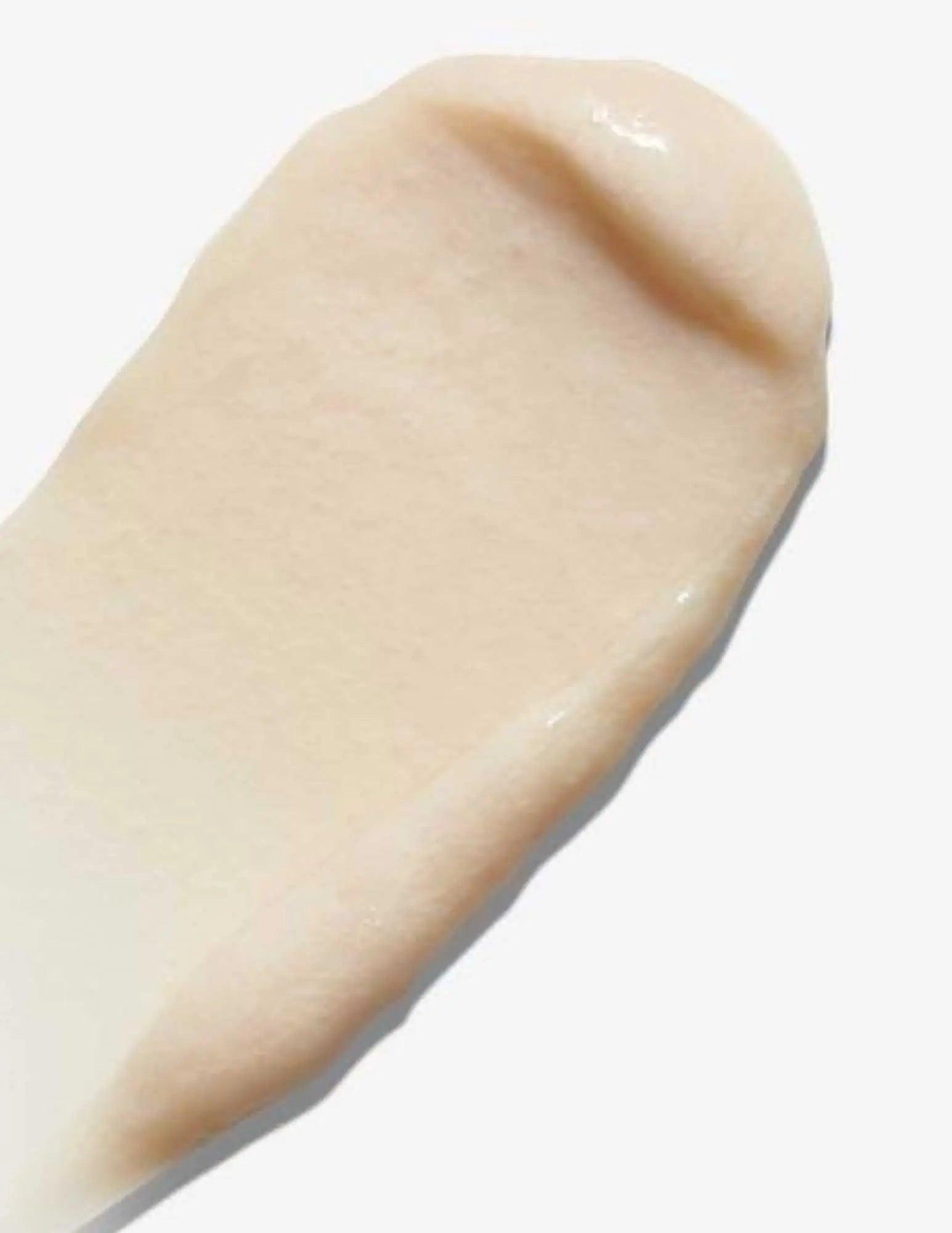 Creamy texture of Redken All Soft Mega Curls Hydramelt Treatment for curly hair hydration.