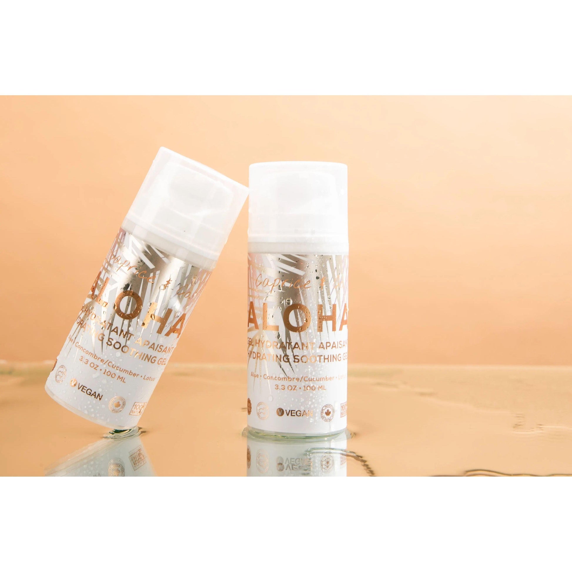 Aloha Aloe + Lotus Soothing Gel in two bottles with a reflective surface, showcasing a vegan, hydrating skincare product.