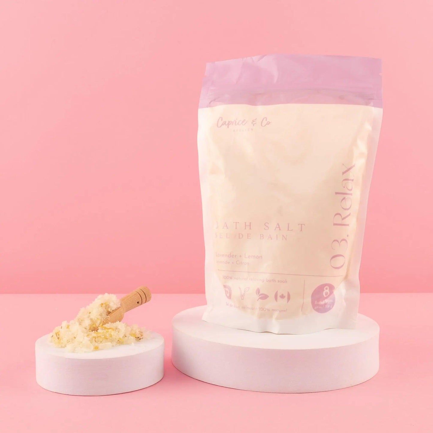 All natural bath salts packaging on pastel background, featuring ingredients for relaxation and soothing properties.