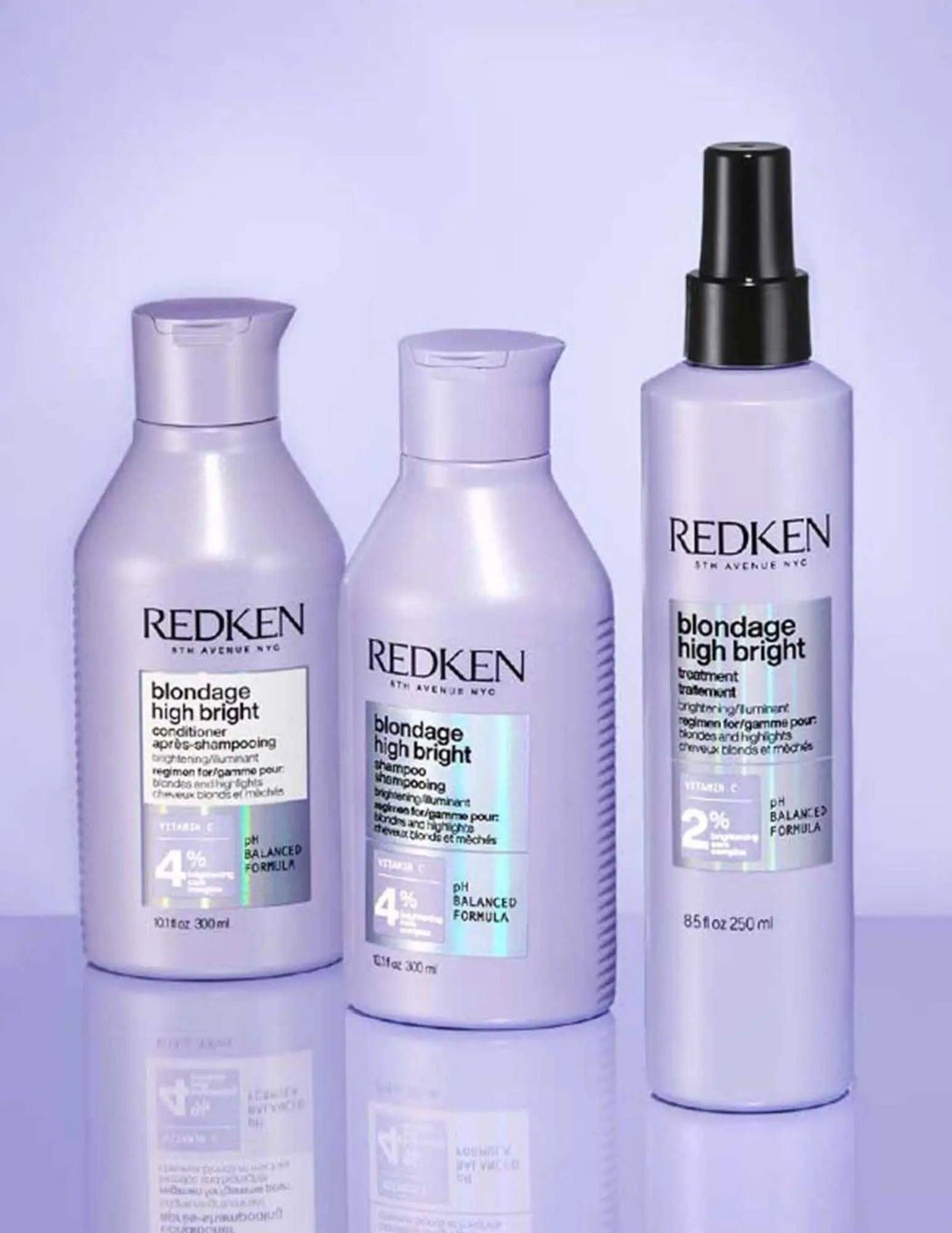 Redken Blondage High Bright Shampoo and conditioner bottles on a purple background, designed for vibrant blonde hair care.