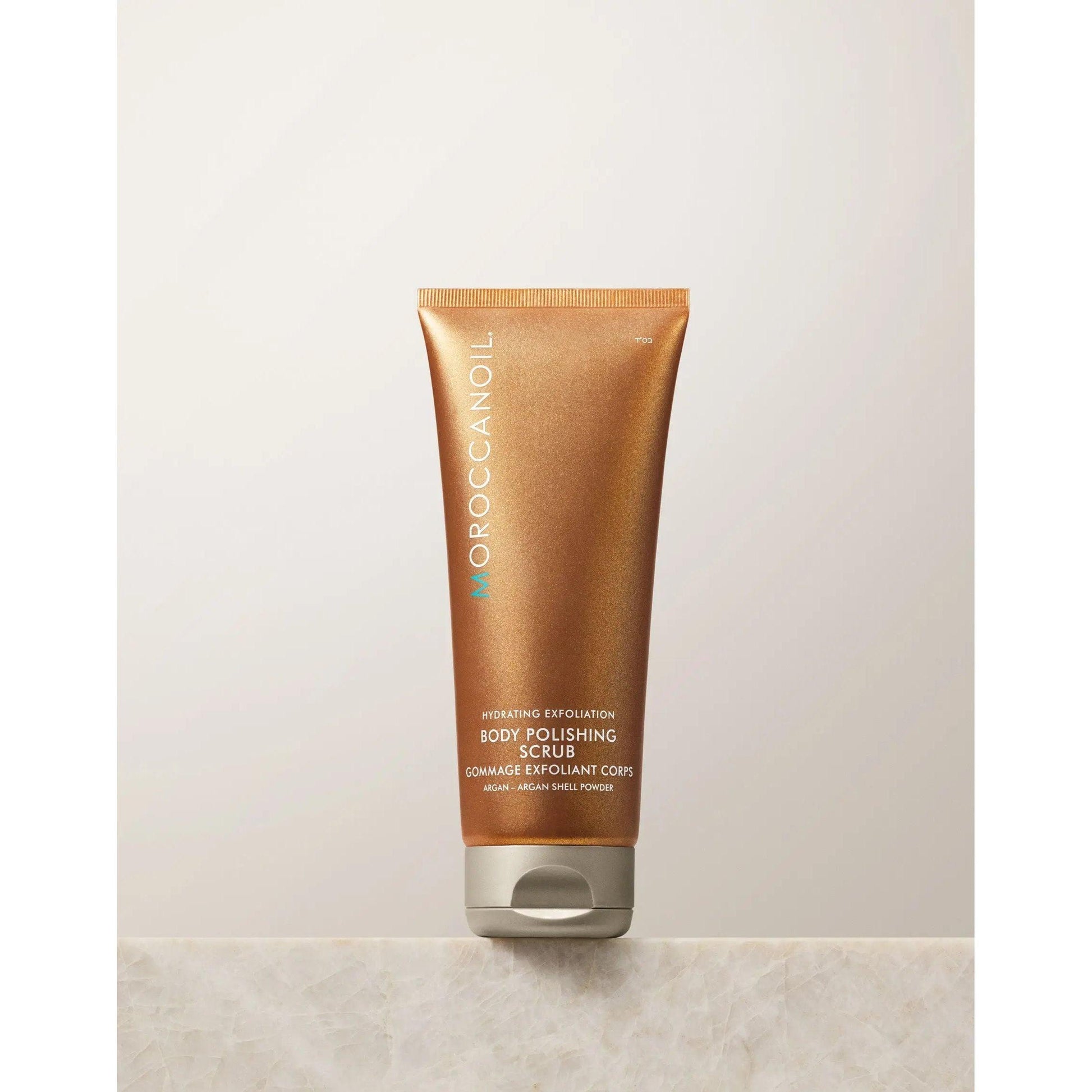 Moroccanoil Body Polishing Scrub Original packaging, a moisturizing exfoliating scrub for brighter skin.