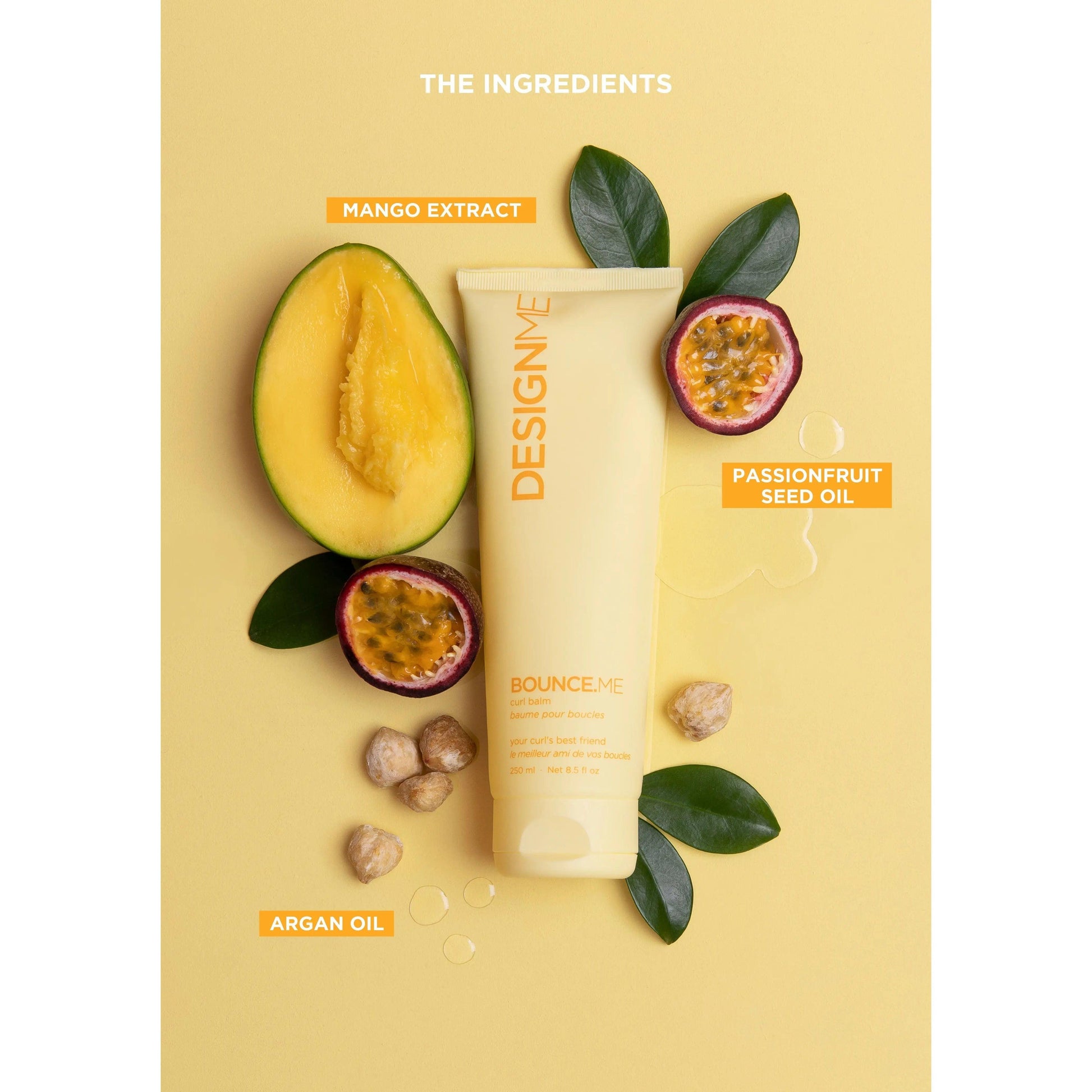 Hair product with mango extract, passionfruit seed oil, and argan oil ingredients against a yellow background.