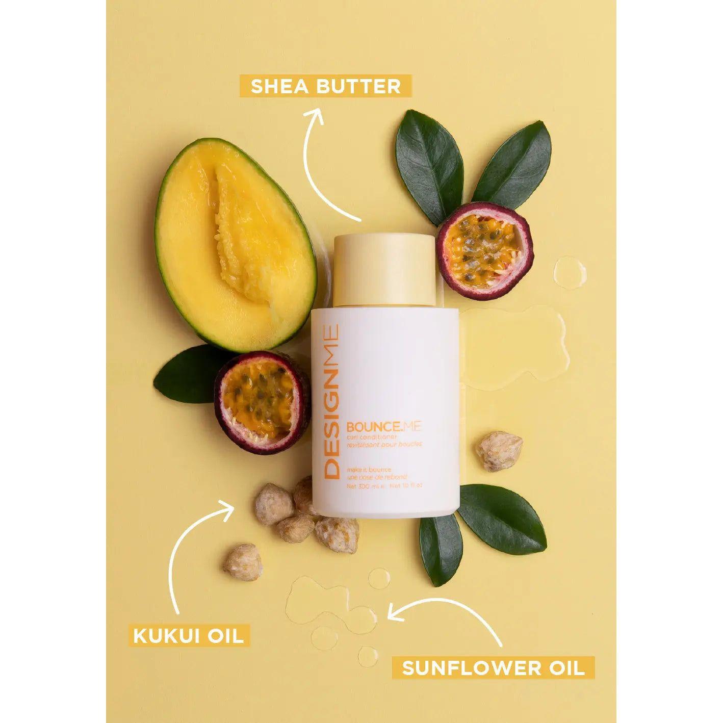 DesignMe Bounce Me hair product with shea butter, kukui oil, and sunflower oil on a yellow background with mango and passion fruit