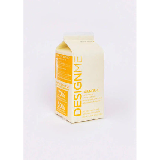 DesignMe Bounce Me hair product packaging with yellow and white carton design.