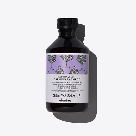 Davines Calming Shampoo bottle with label, 250 ml, designed for sensitive scalps, soothing formula with natural ingredients.