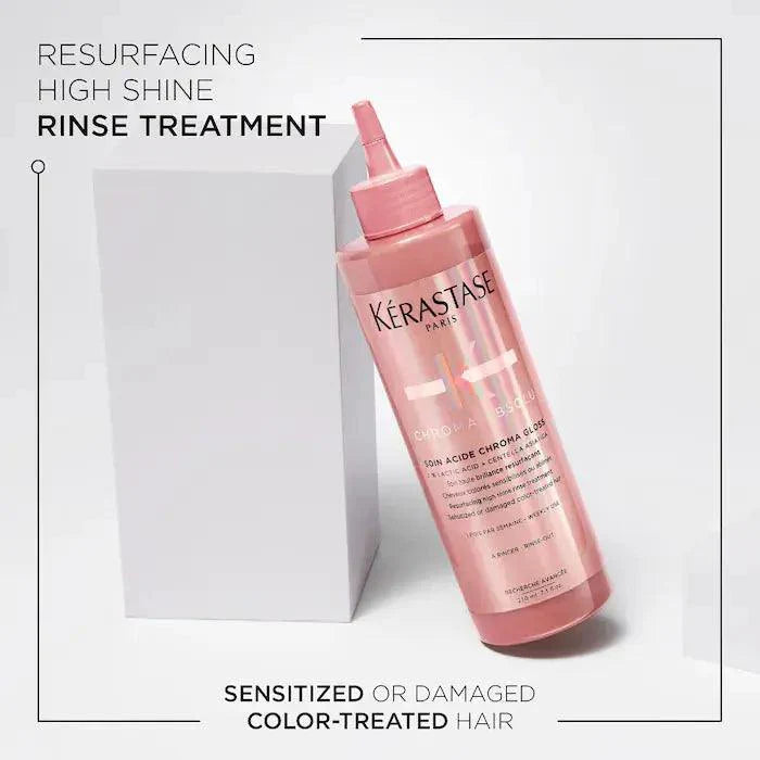 Kérastase Paris resurfacing high shine rinse treatment for sensitized or damaged color-treated hair in pink bottle.