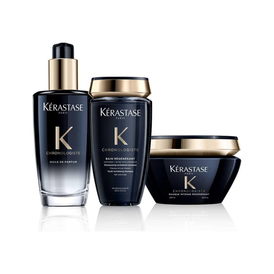 Kérastase Chronologiste hair care set including Huile de Parfum, Bain Régénérant, and Masque Intense Régénérant products in black bottles.