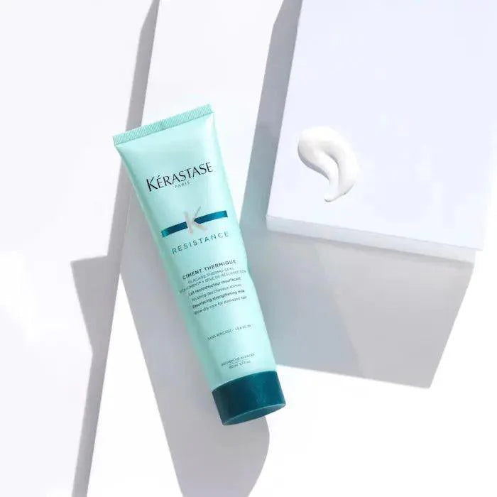 Kérastase Resistance Ciment Thermique leave-in hair conditioner cream on white background.