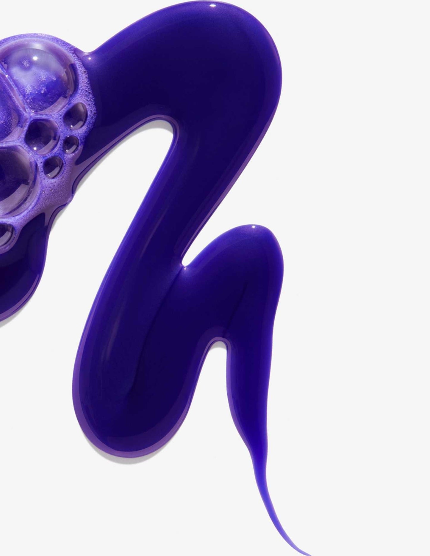 Purple toning shampoo texture, ideal for neutralizing brassy tones in blonde and highlighted hair.