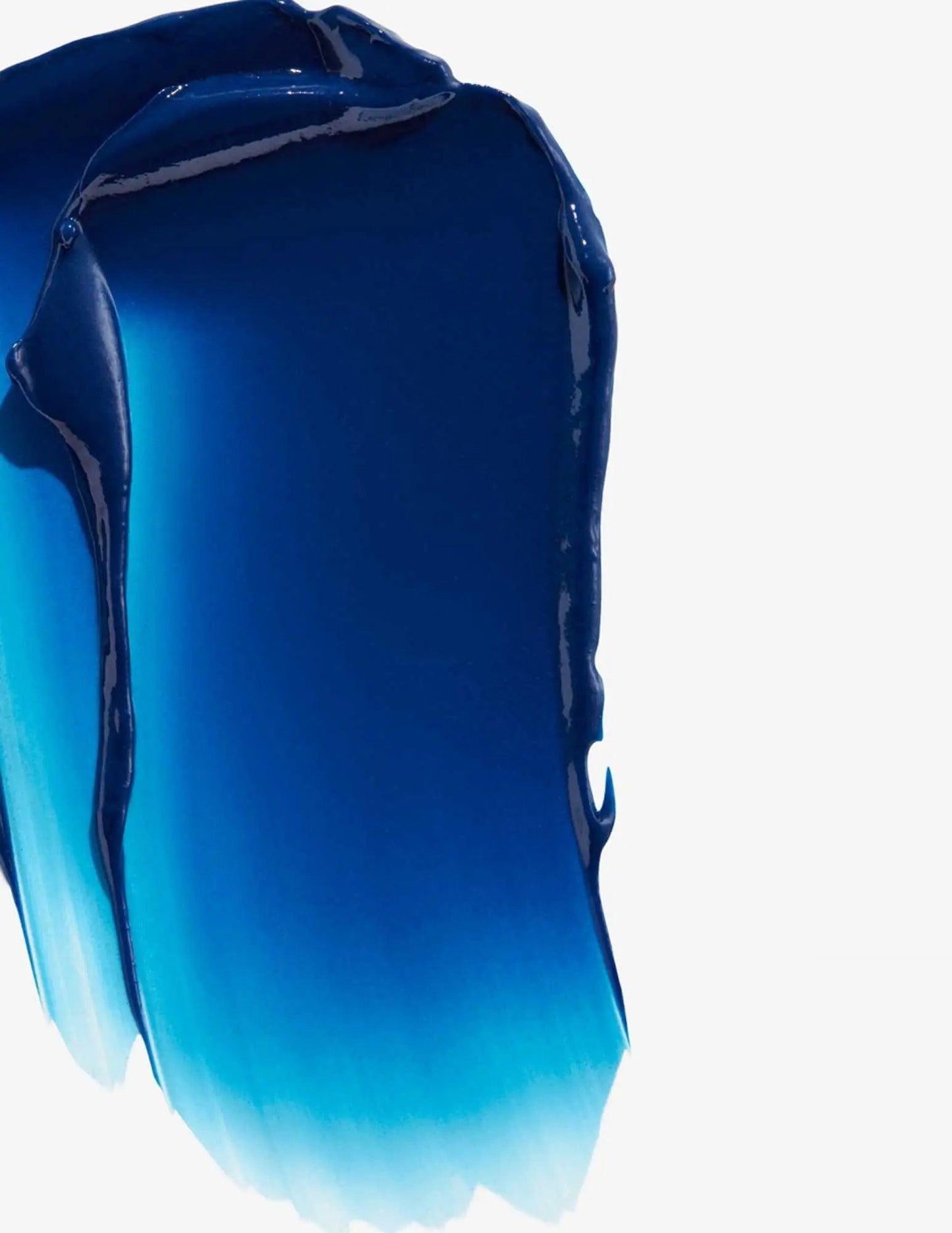 Blue color-depositing conditioner texture with ombre effect for enhancing brown hair tones.