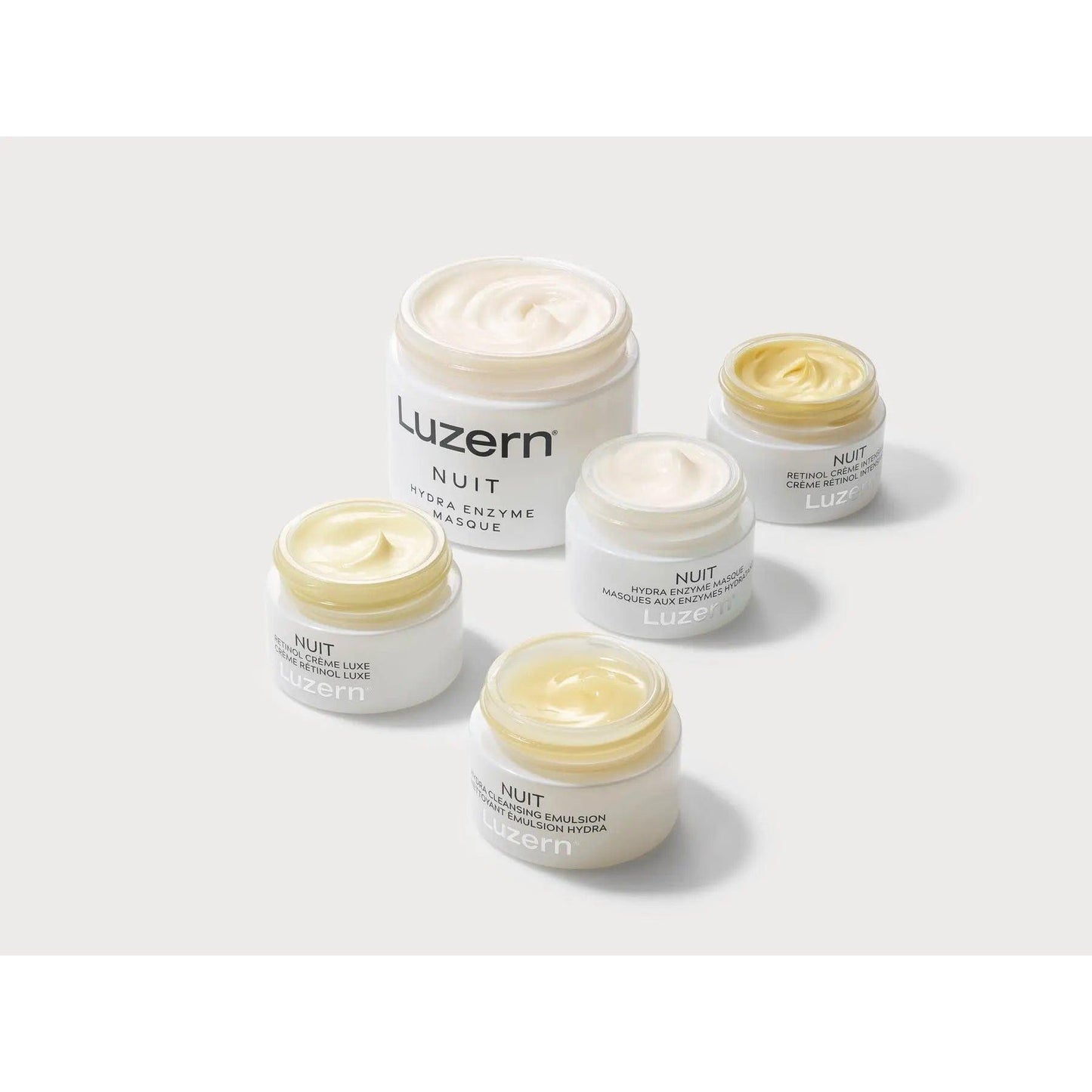 Group of Luzern Nuit skincare products, including hydrating and firming creams for nighttime use.