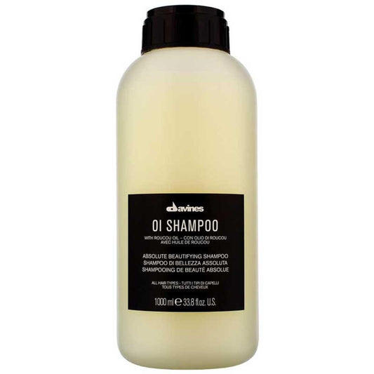 Davines Essential Haircare OI Shampoo 1000ml bottle for soft, shiny, and voluminous hair with Roucou oil.