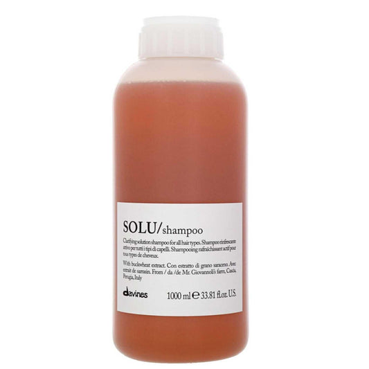 Davines Essential Haircare SOLU Shampoo 1000ml bottle for deep cleansing and refreshing scalp with natural ingredients.
