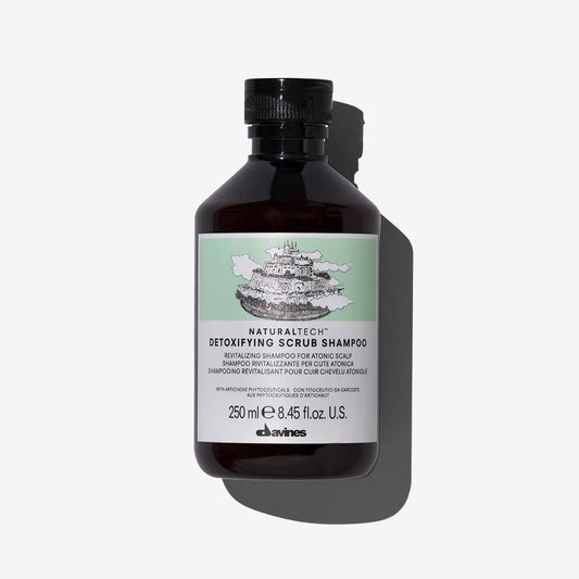 Davines Detoxifying Scrub Shampoo 250ml bottle designed to deep-cleanse hair and scalp, removing impurities and buildup.