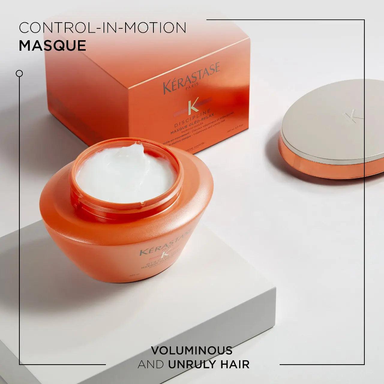 Kerastase Discipline Masque Oléo-Relax Mask in an orange jar, designed for nourishing and taming frizzy, unruly hair.