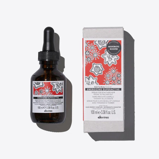 Davines Energizing Superactive serum in amber bottle with box, designed to revitalize and nourish all hair types.