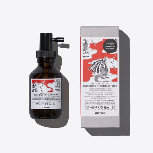 Davines Energizing Thickening Tonic bottle and box, promoting volume and body for fine hair. 100 mL size.