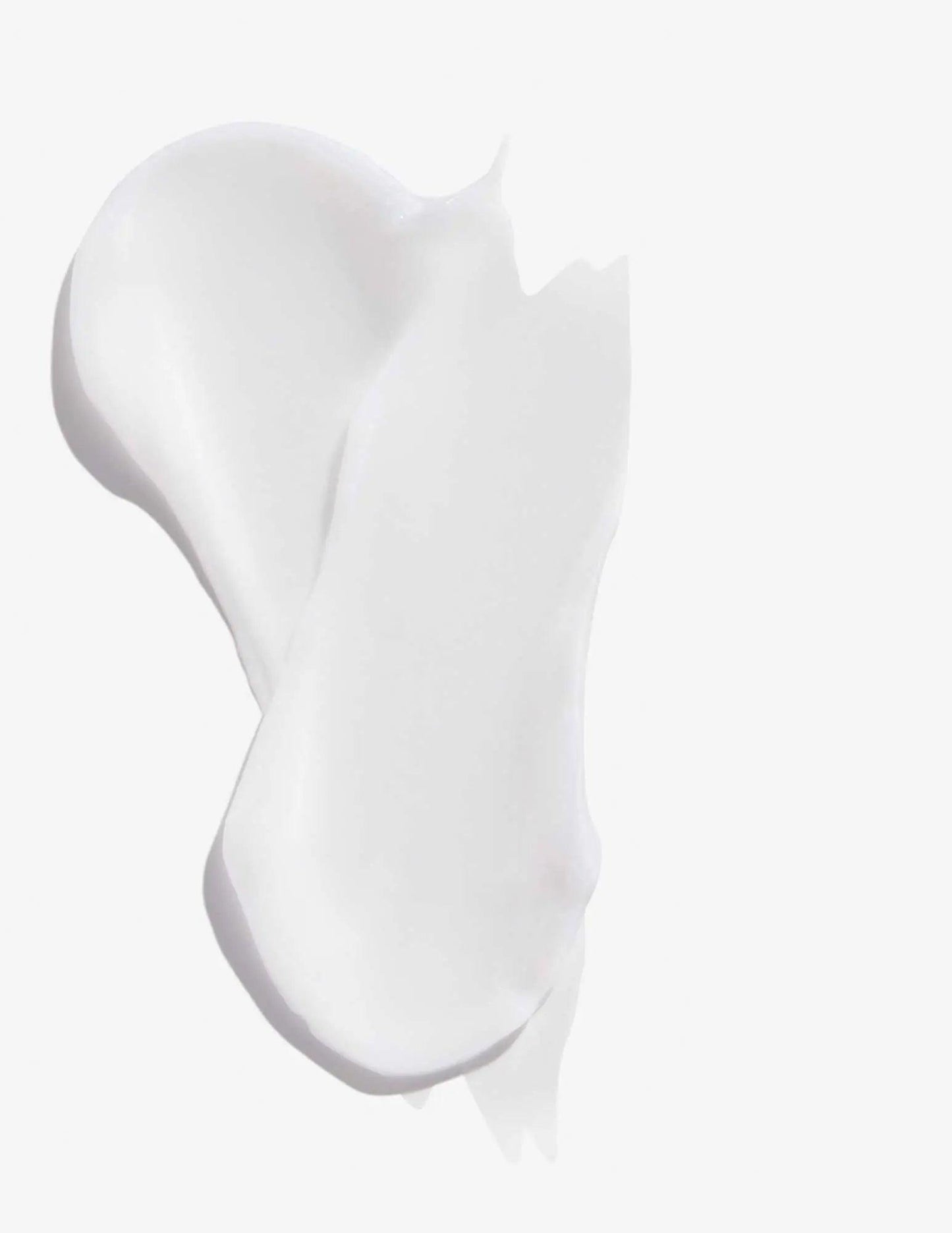 Swatches of creamy white conditioner from Redken Extreme, designed for damaged hair repair and strengthening.