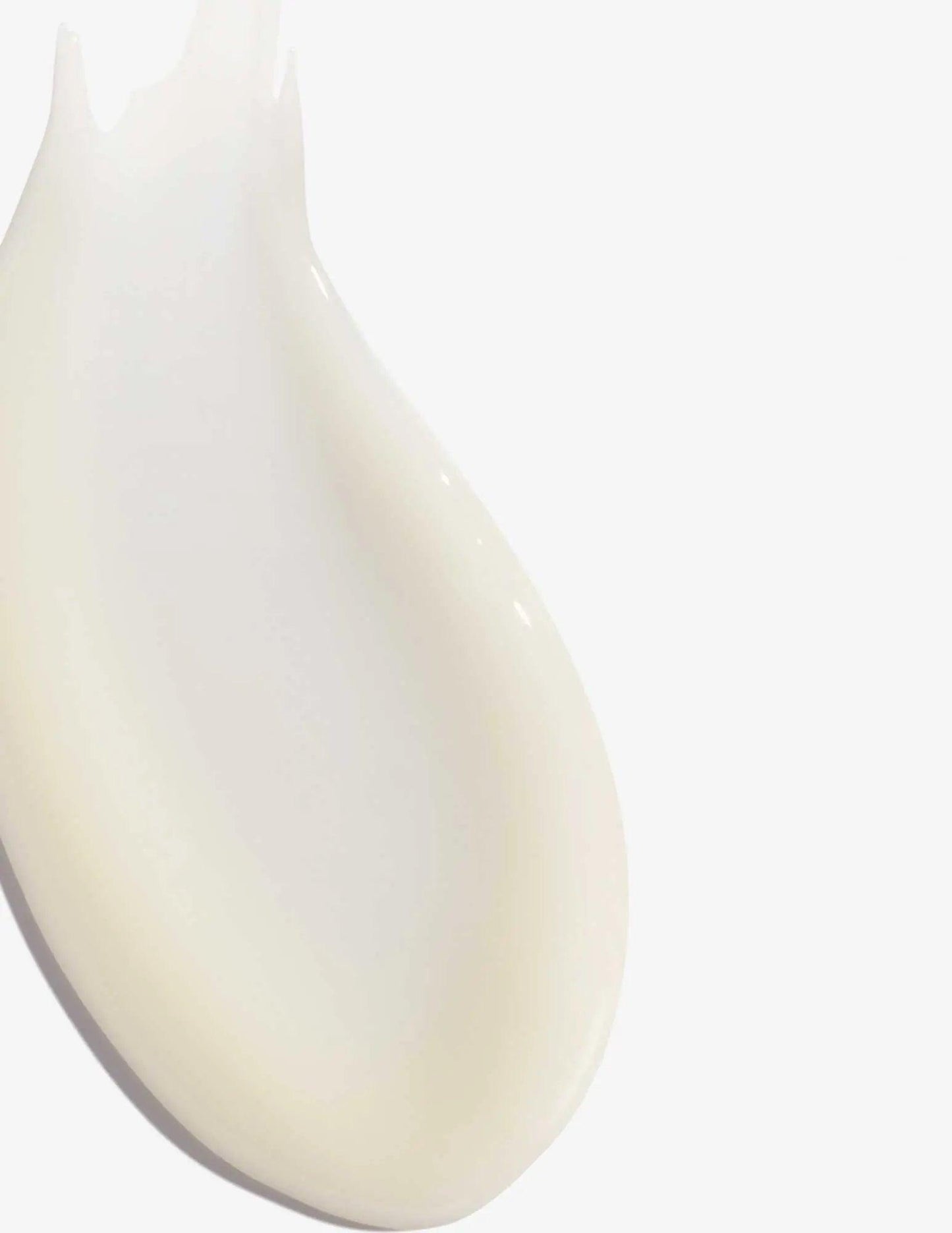 Creamy texture of Redken Extreme Length Sealer designed to strengthen and fortify hair lengths.