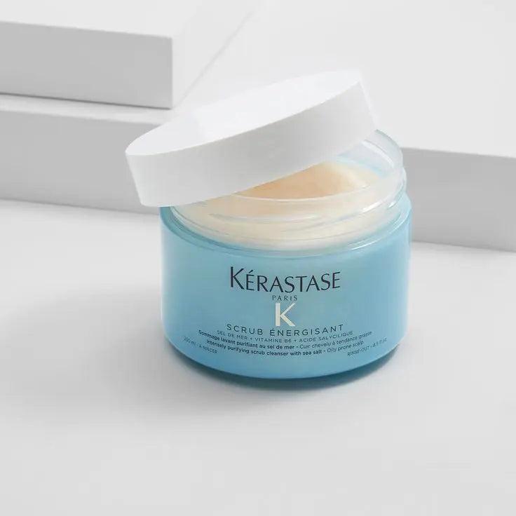 Kerastase Scrub Energisant exfoliating hair scalp treatment in blue jar with white lid on minimalist background