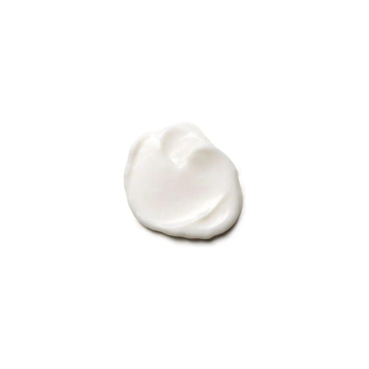 A smooth, creamy dollop of Moroccanoil® Hydrating Conditioner on a white background, ideal for nourishing dry hair.
