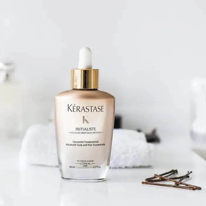 Kérastase Initialiste Advanced Scalp and Hair Concentrate with towel and bobby pins in background
