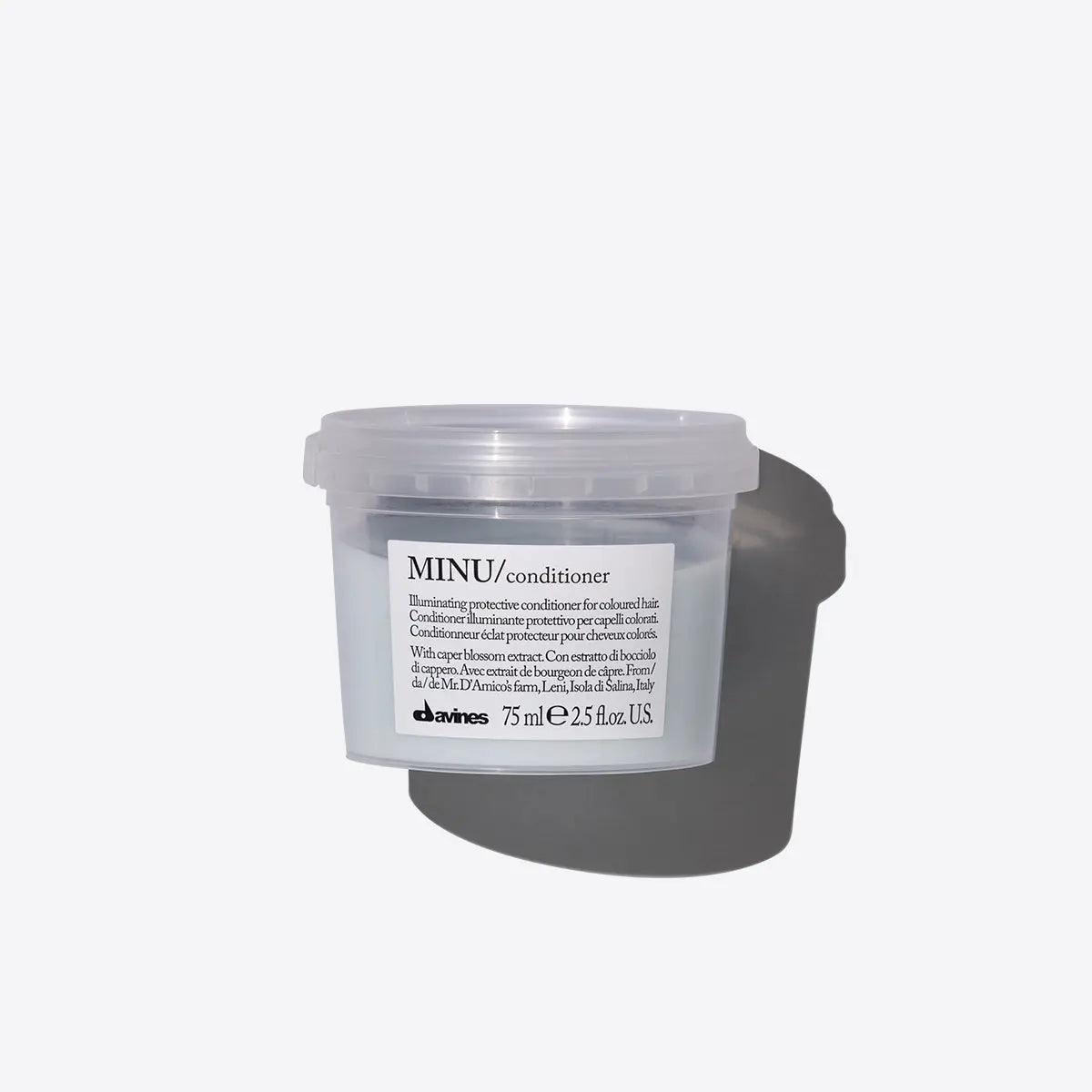 75 ml Davines MINU hair conditioner tub on white background for volume and shine.