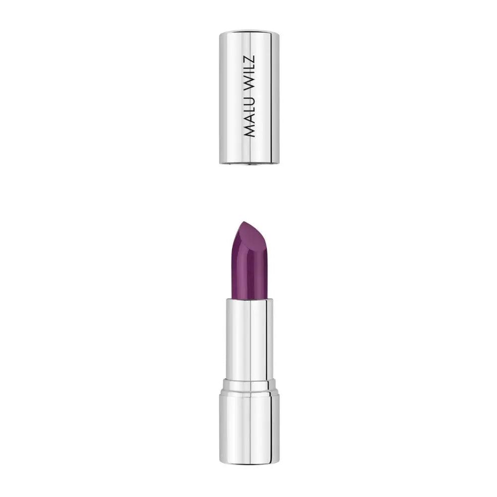 Malu Wilz Nourishing Lipstick in vibrant purple shade with silver packaging, showcasing luxurious lip color and care.