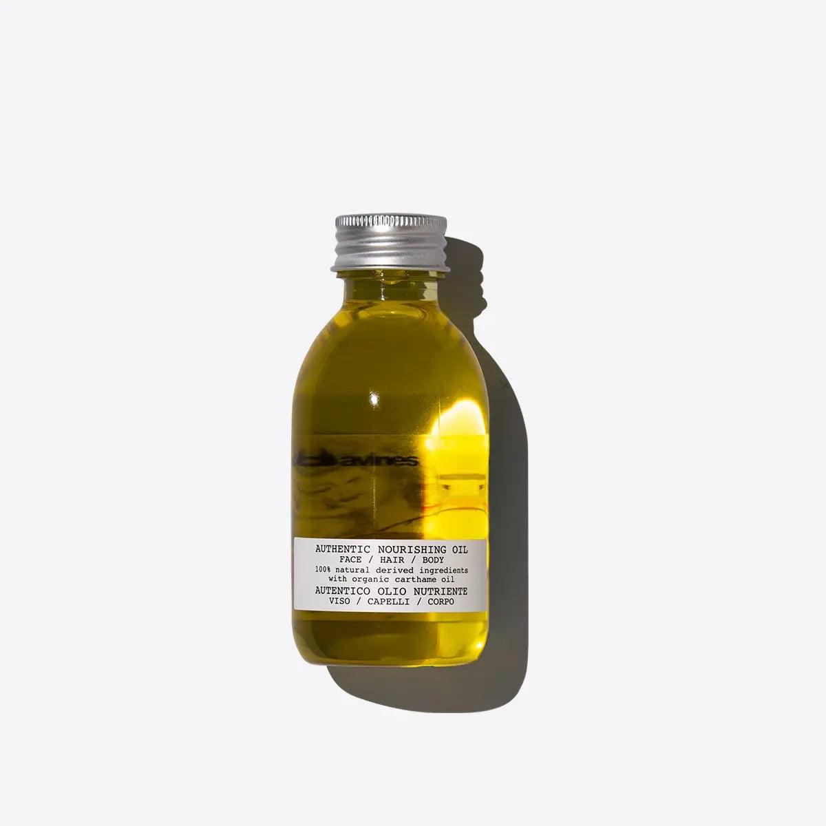 Nourishing oil in a clear bottle, ideal for moisturizing hair and skin, promoting softness and shine.
