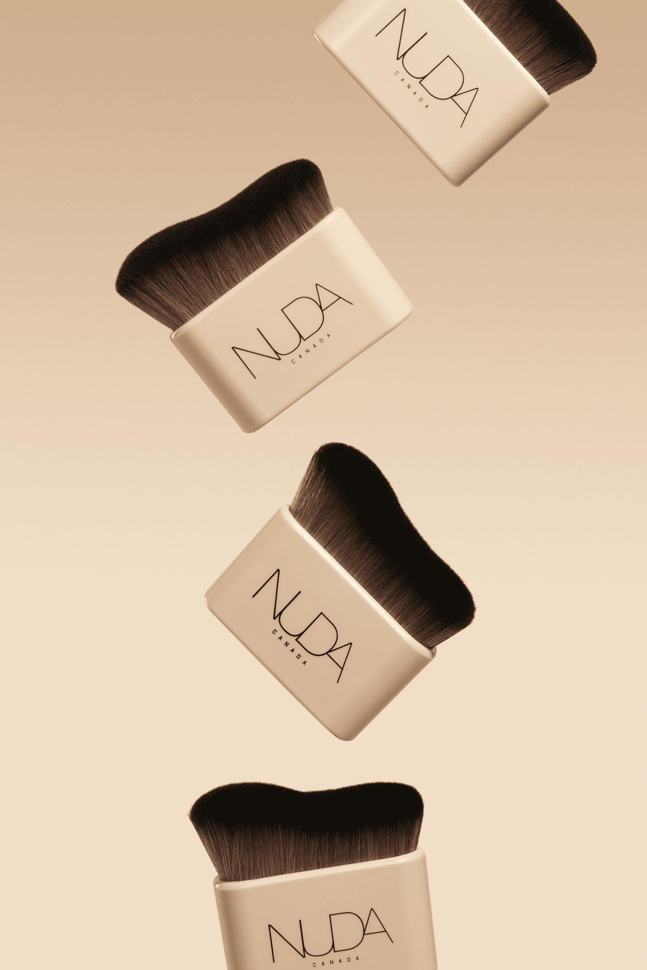 Four Nuda Blending Brushes showcasing ultra-soft vegan bristles for flawless tan blending and contouring.