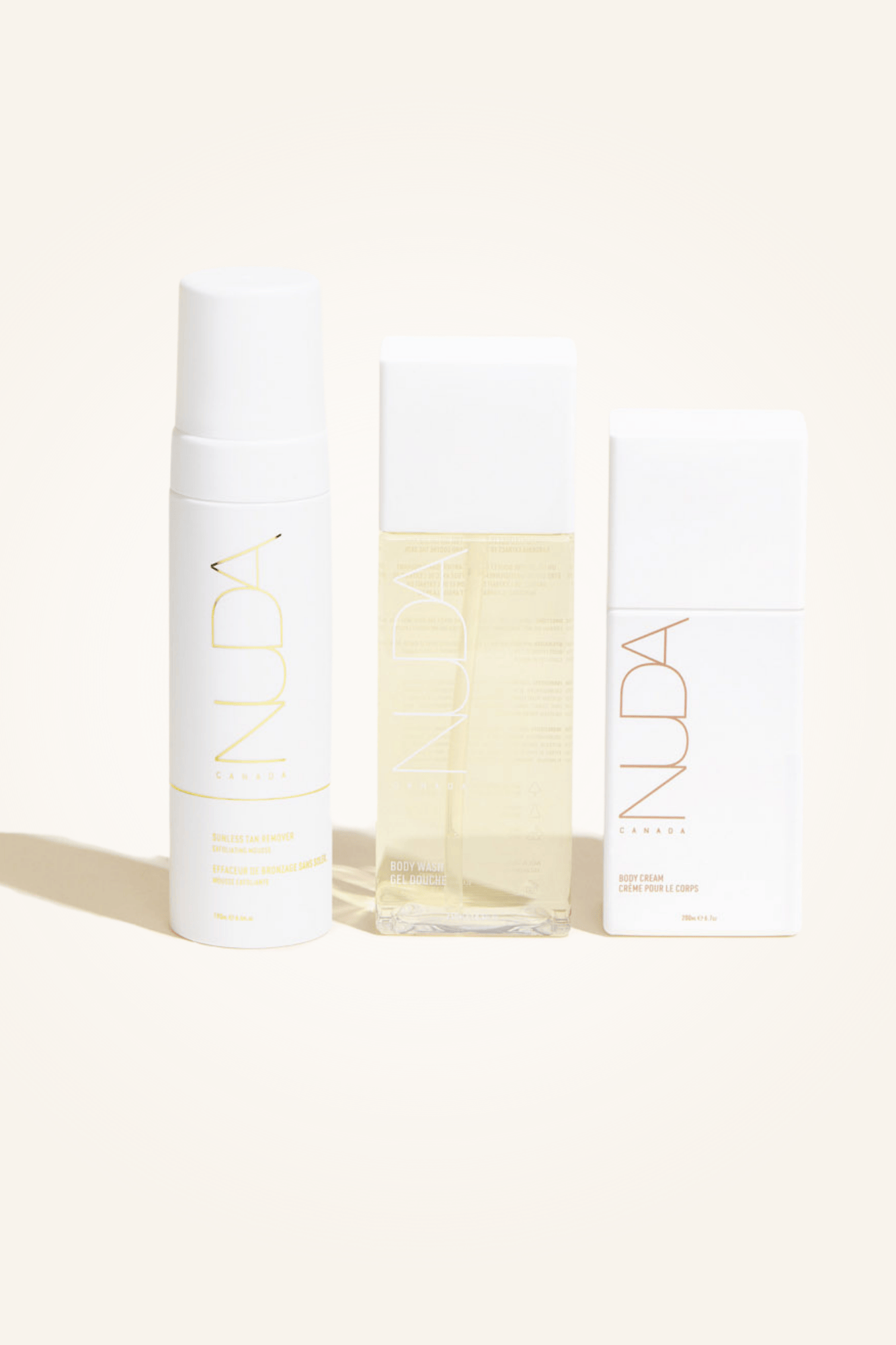 Body Essentials Trio by Nuda, featuring body exfoliant, wash, and cream for a radiant sunless tan.