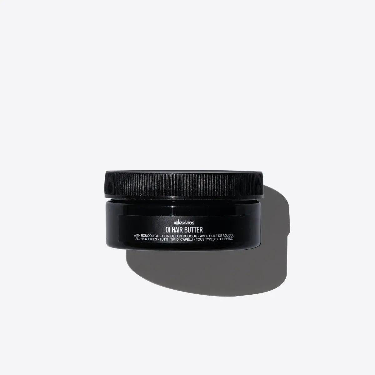 Professional Davines OI Hair Butter, deeply nourishing hair treatment in black jar, rich in natural oils for smooth, shiny hair.