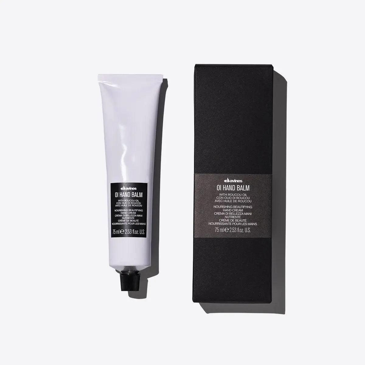 Premium OI hand balm packaged in a white tube and black box, perfect for moisturizing and nourishing dry hands.