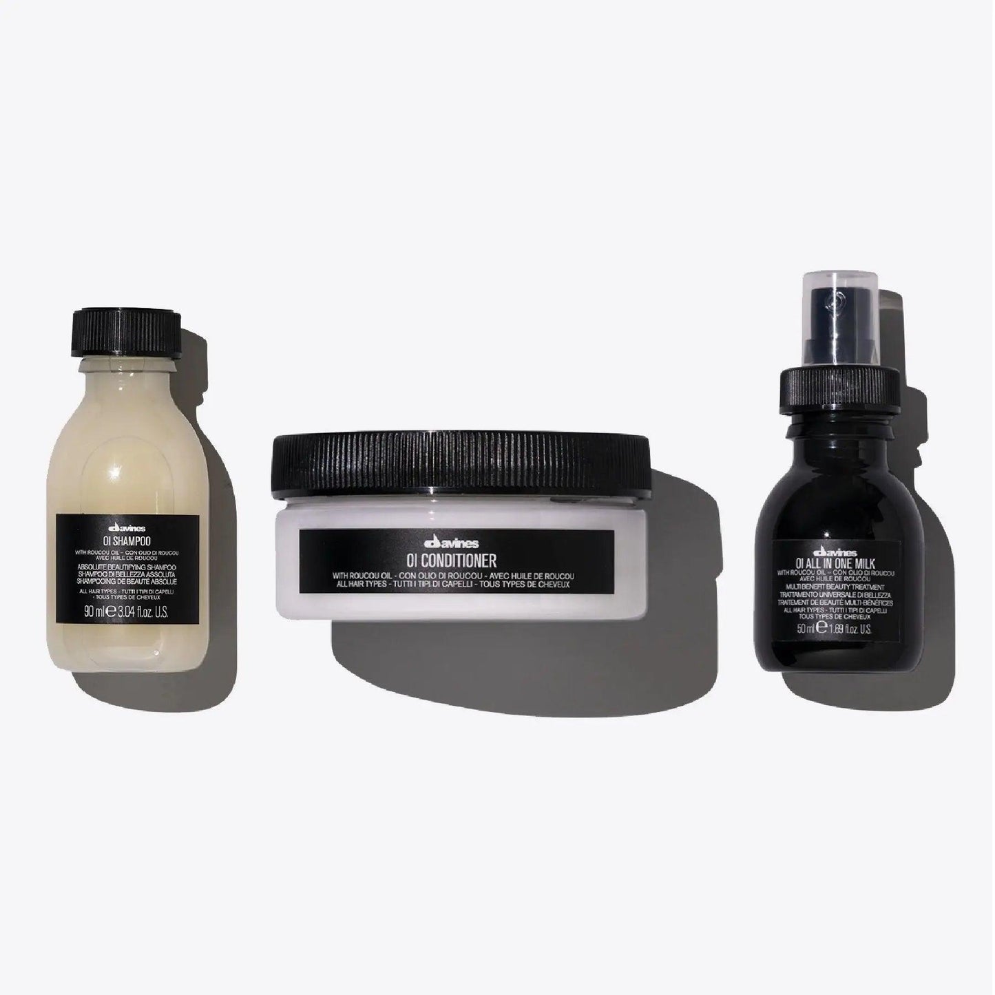 OI Travel Set including OI Shampoo, OI Conditioner, and OI All in One Milk for nourishing all hair types.