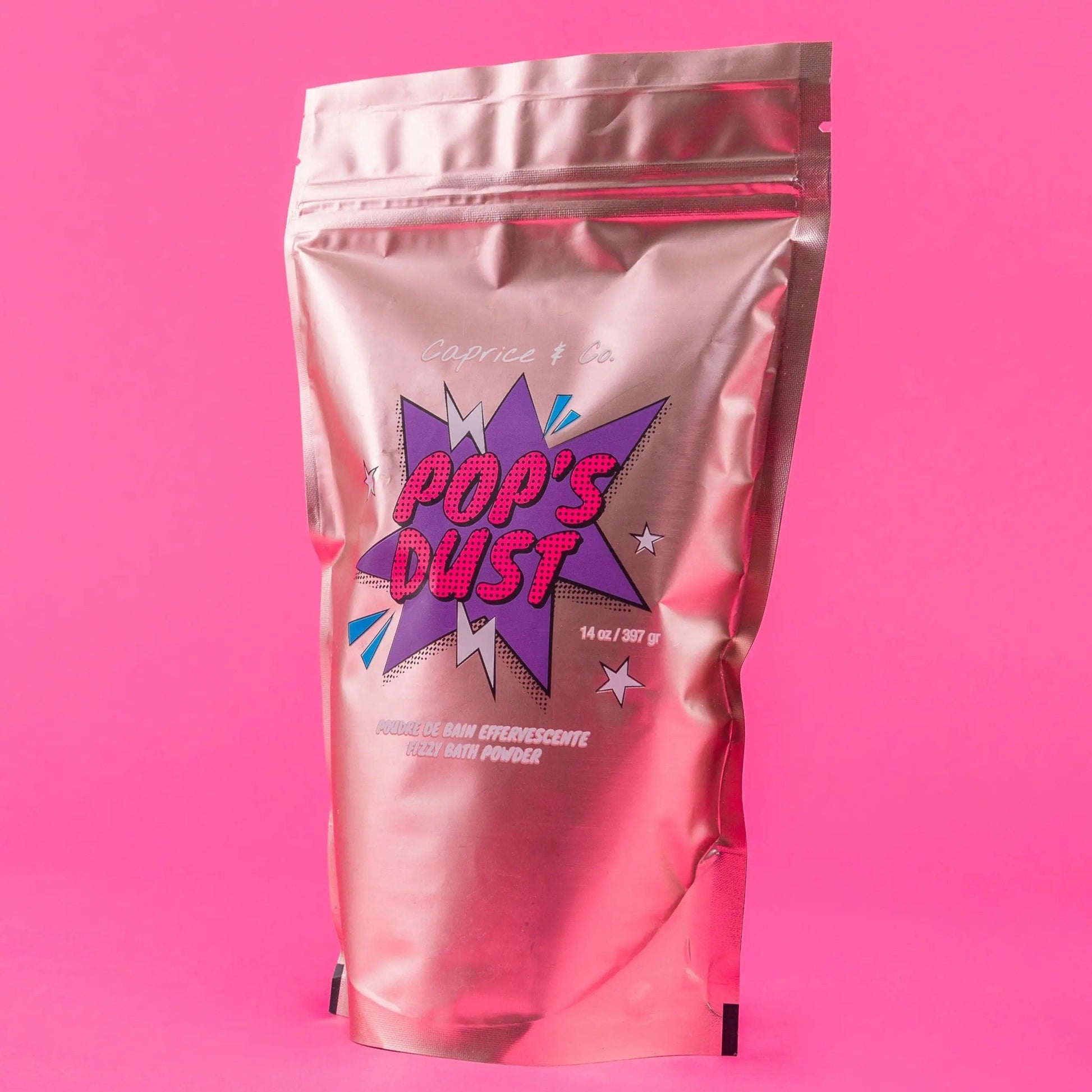 Pop's Dust fizzy bath powder package, 14 oz, vibrant design with sour candy scent, cruelty-free and plant-based ingredients.