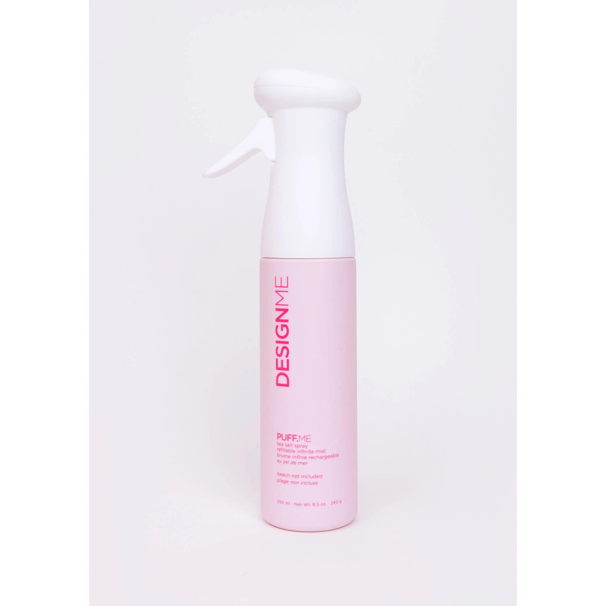 Design.Me Puff Me Volumizing Hair Spray in pink and white bottle for hair volume and texture.