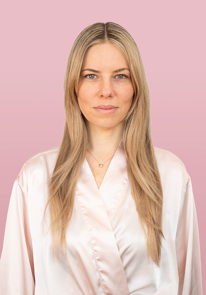 Model showcasing healthy, silky hair for PUFF.ME Volume Glitz Kit on a pink background.