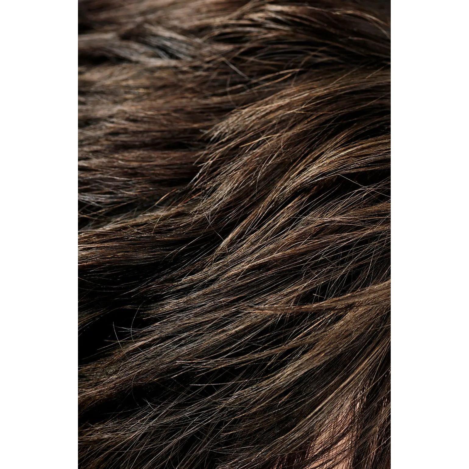 Close-up of dark brown hair with highlights showing texture and shine
