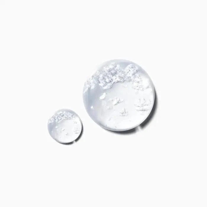 Clear serum droplets highlighting Kérastase Potentialiste Hydrating & Soothing Scalp Serum for healthy hair growth.