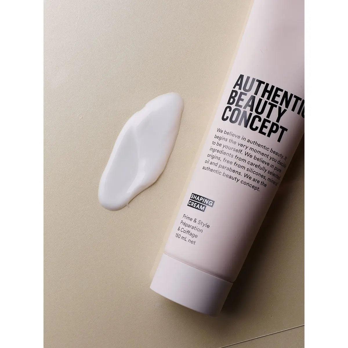 Authentic Beauty Concept Shaping Cream tube and a dollop of cream on a surface, showcasing a vegan, cruelty-free styling product.