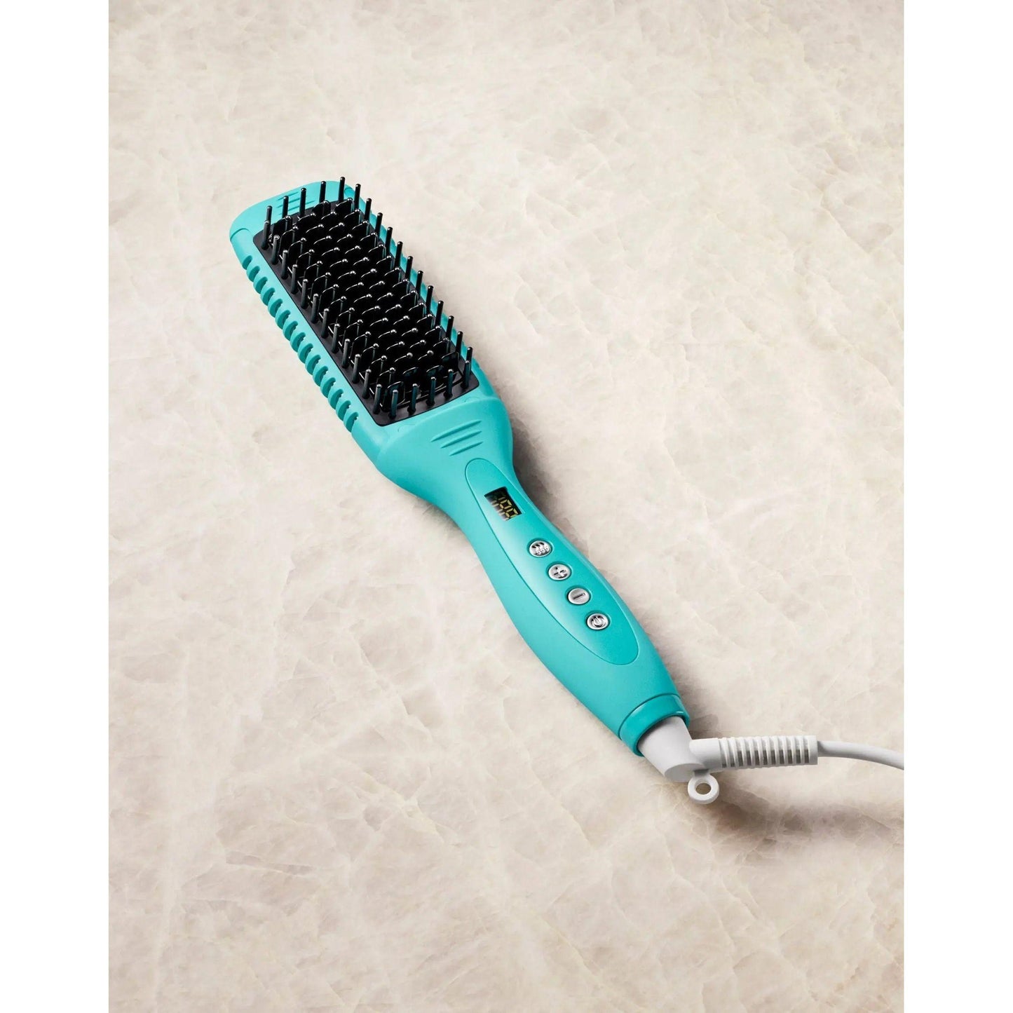 Smooth Style Ceramic Heated Brush in turquoise with digital controls for quick heat styling and frizz-free results.