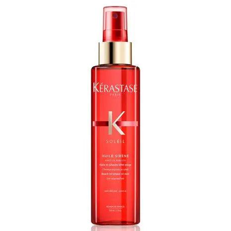 Kérastase Soleil Huile Sirene Hair Oil Mist in a spray bottle, providing sun protection and shine for all hair types.