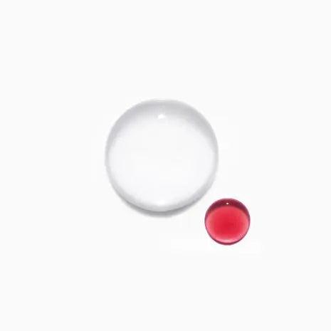 Clear and red spherical liquid droplets on a white background, showcasing different sizes and colors.